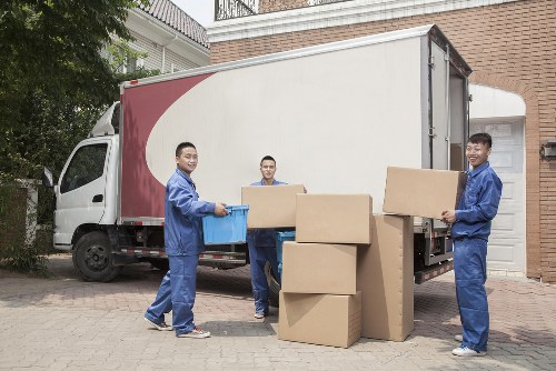 Removal van and moving boxes in a Merton residential street