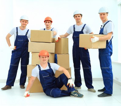 Professional removals team loading items for a business move in Merton
