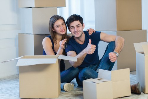 Careful packing of household items for relocation in a Merton property