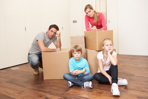 Moving van and packed boxes for a local relocation in Merton