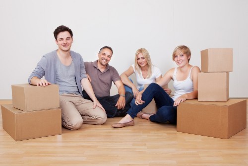 Local movers handling furniture in a flat move in Merton