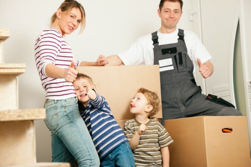 Careful loading of boxes and belongings for a Merton man and van service